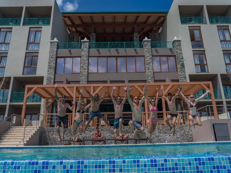 Guests jumping into the pool